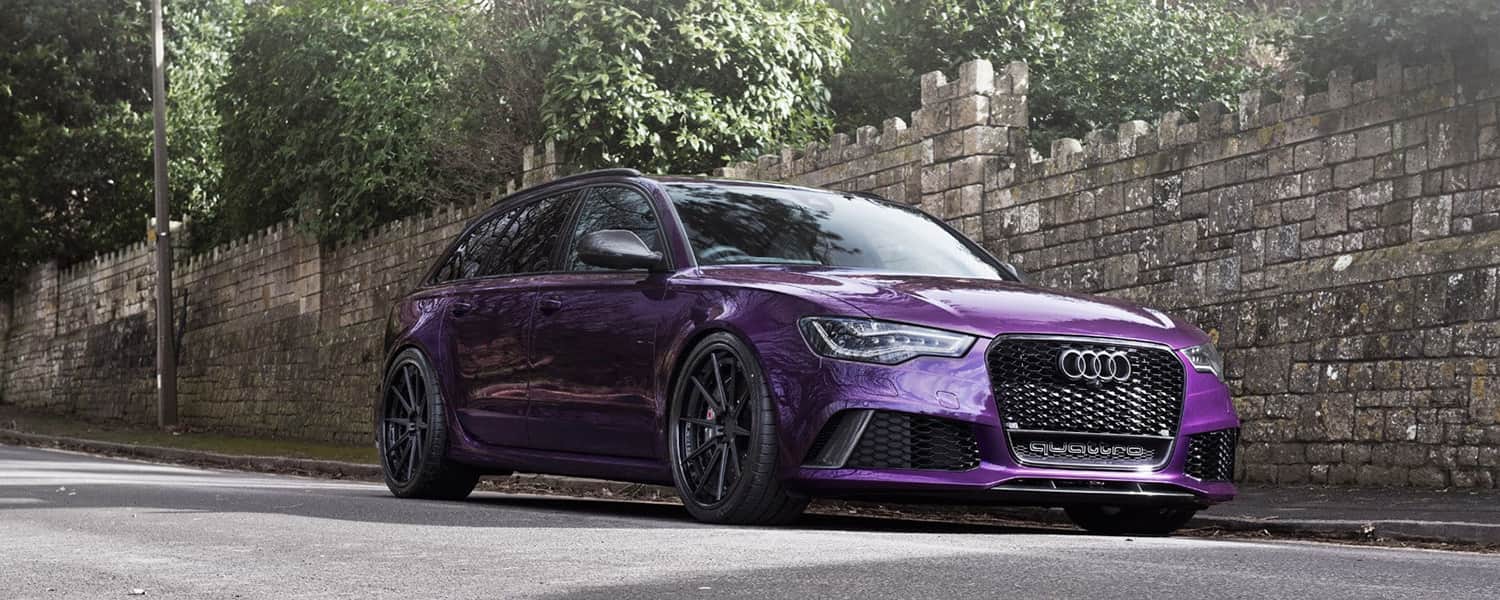 Purple Audi estate viewed from the front and side