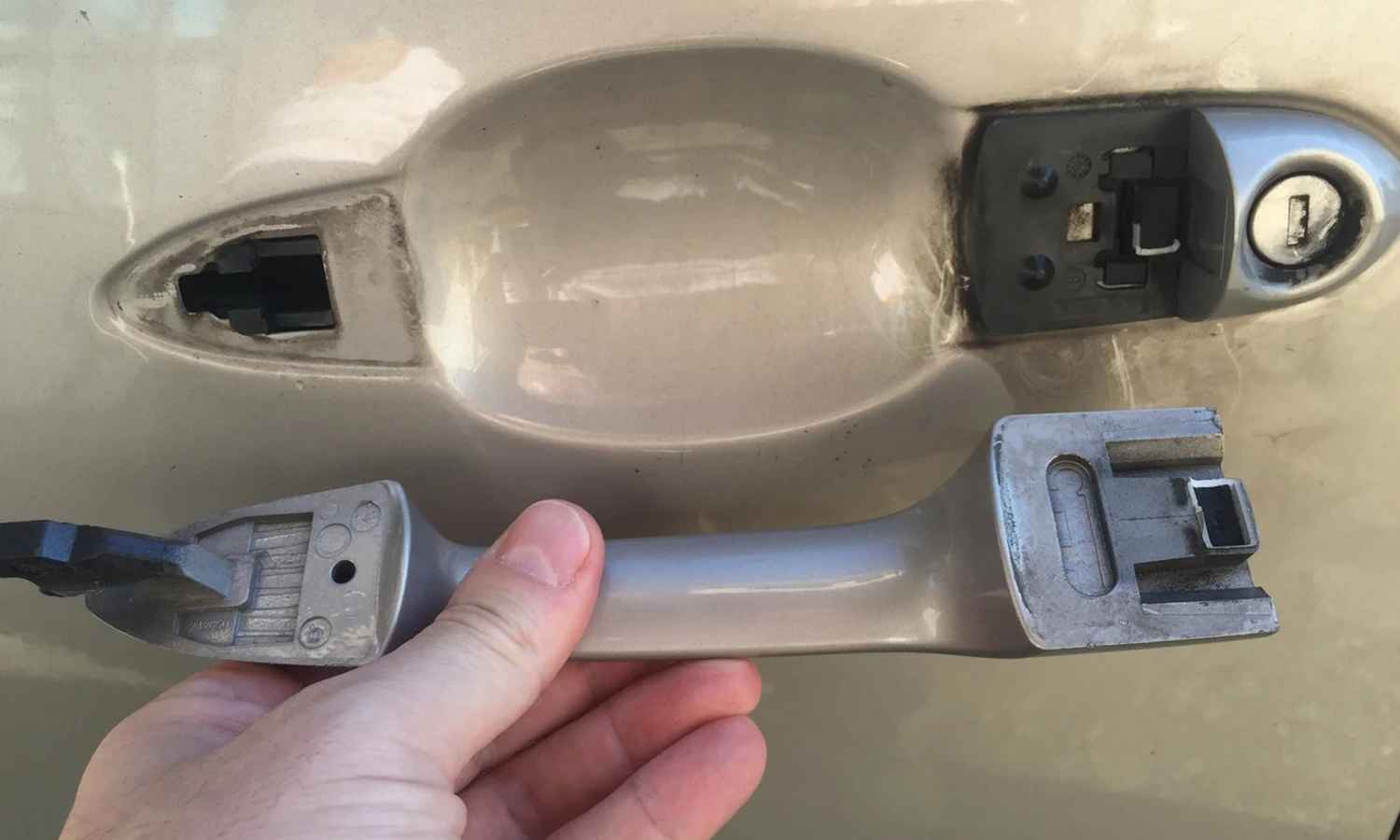 Audi exterior door handle removed for latch and handle diagnosis