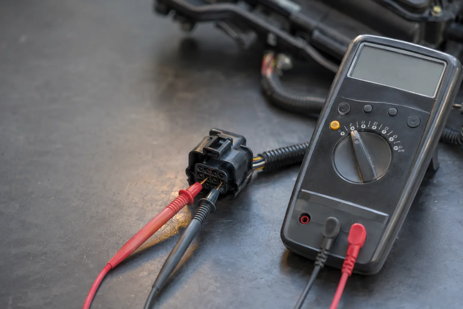 Testing an Audi electrical connector with a multimeter